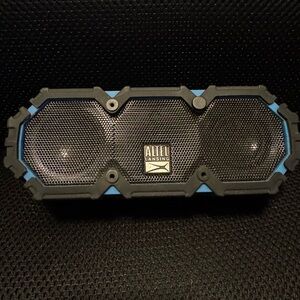 Altec Lansing Bluetooth speaker, works as it should. Just don’t have charger.